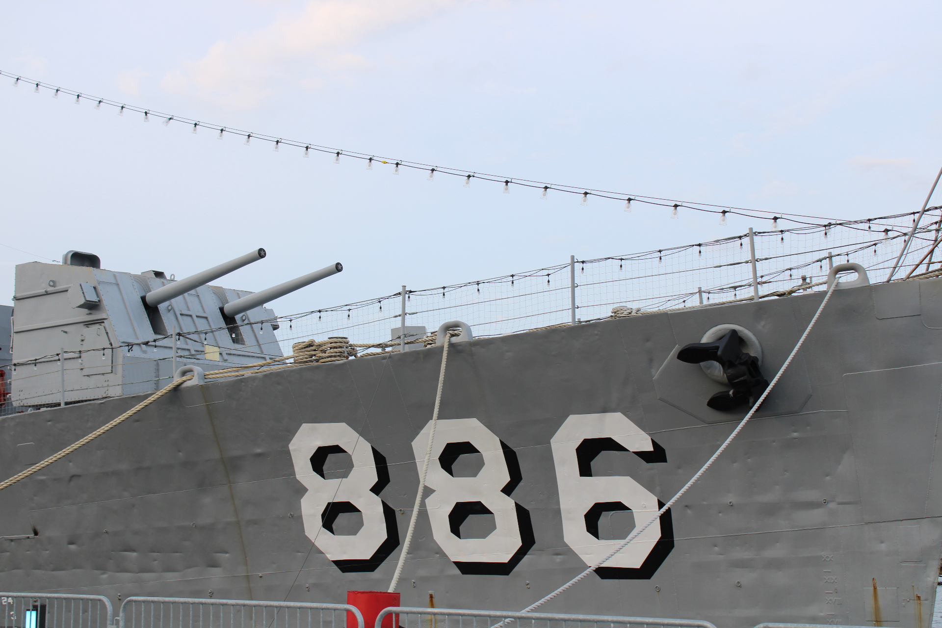 Close-up of the USS Orleck hull with the ship number 886 and deck guns visible