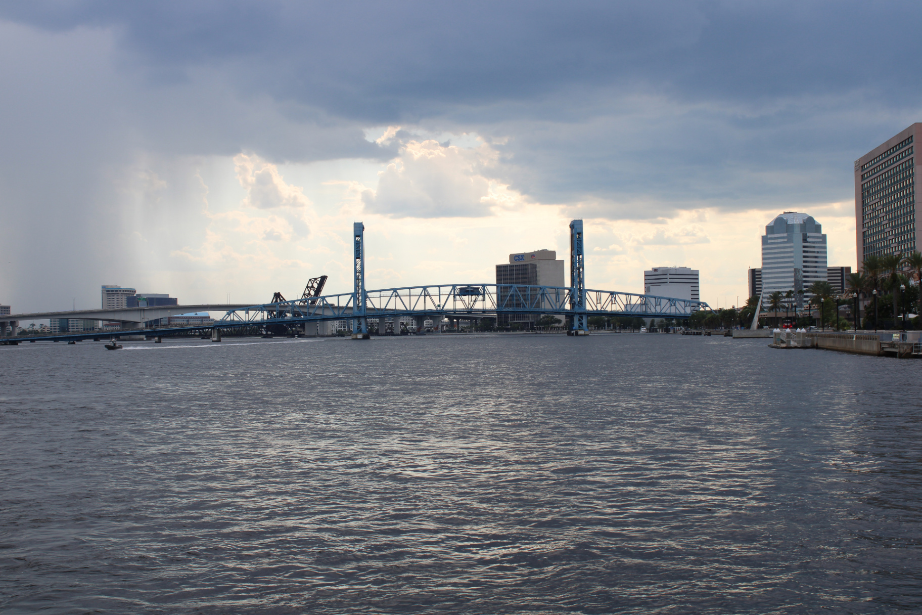 Main Street Bridge over the St. Johns River with the downtown Jacksonville skyline under cloudy skies